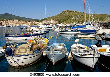 Stock Image - Boats in harbour, Ortobello, Tuscany, Italy, Europe . Fotosearch