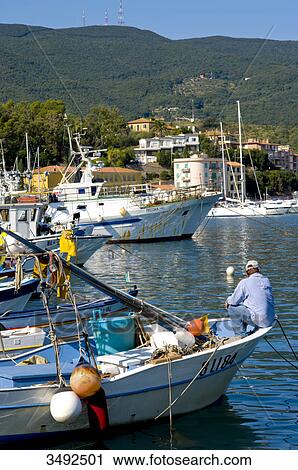Stock Image - Boats in harbour, Ortobello, Tuscany, Italy, Europe . Fotosearch