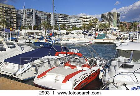 Boats moored at harbor, Costa Del Sol, Spain View Large Photo Image Stock Image - Boats moored at harbor, Costa Del Sol, Spain . Fotosearch