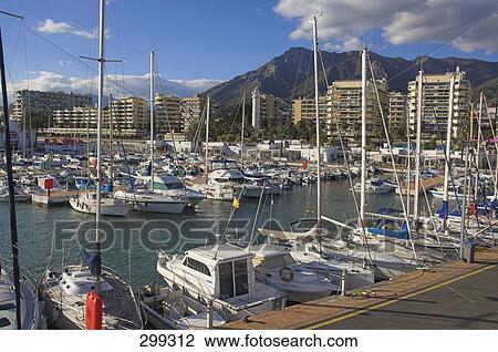 Boats moored at harbor, Costa Del Sol, Spain View Large Photo Image Stock Image - Boats moored at harbor, Costa Del Sol, Spain . Fotosearch