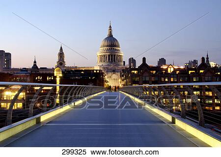 Stock Photography - Bridge across river leading towards church, Millennium Bridge, Thames River, St. Pauls Cathedral, London, England . Fotosearch