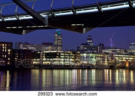 Bridge lit up at night, Millennium Bridge, Thames River, London, England View Large Photo Image Stock Image - Bridge lit up at night, Millennium Bridge, Thames River, London, England . Fotosearch