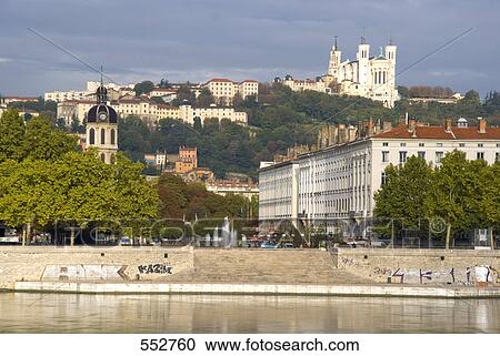 Buildings at riverbank with church on hill, Notre Dame De Fourviere, Rhone River, Lyon, Rhone-Alpes, France View Large Photo Image Stock Image - Buildings at riverbank with church on hill, Notre Dame De Fourviere, Rhone River, Lyon, Rhone-Alpes, France . Fotosearch