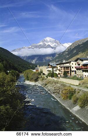 Buildings at riverfront, Lanslebourg-Mont-Cenis, Savoie, France View Large Photo Image Picture - Buildings at riverfront, Lanslebourg-Mont-Cenis, Savoie, France . Fotosearch