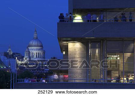 Stock Photo - Buildings in city at dusk, St Pauls Cathedral, National Theatre, London, England . Fotosearch