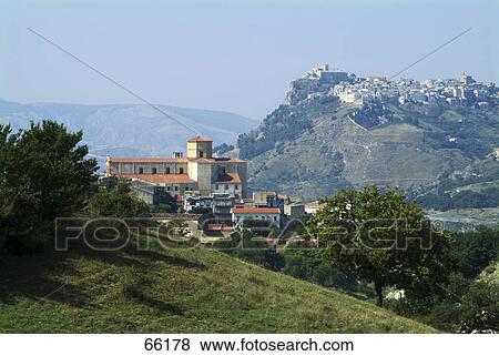 Stock Photo - Buildings on mountains, Monti Sicani, Chiusa Sclafani, Aeolian Islands, Sicily, Italy . Fotosearch
