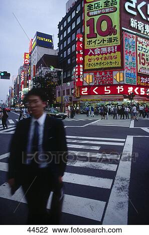 Businessman crossing road, Tokyo, Japan View Large Photo Image Stock Image - Businessman crossing road, Tokyo, Japan . Fotosearch
