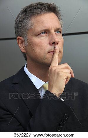 Businessman outdoors thinking View Large Photo Image Stock Photo - Businessman outdoors thinking . Fotosearch