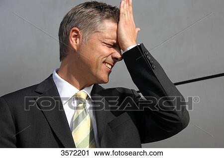 Businessman putting his hand on his head View Large Photo Image Stock Image - Businessman putting his hand on his head . Fotosearch