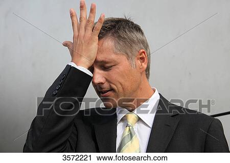 Businessman putting his hand on his head View Large Photo Image Stock Image - Businessman putting his hand on his head . Fotosearch