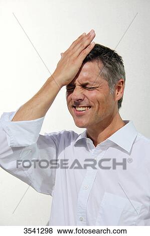 Businessman putting his hand on his head View Large Photo Image Stock Photo - Businessman putting his hand on his head . Fotosearch