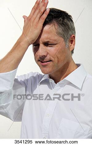 Stock Photography - Businessman putting his hand on his head . Fotosearch