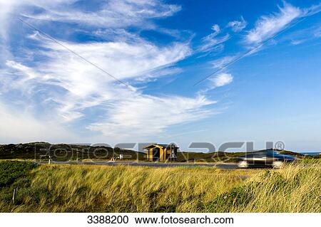 Stock Image - Car on a country road, Rantum, Sylt, Germany . Fotosearch