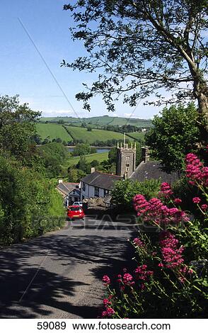 Stock Photo - Car on a road in a village, Dittisham, Devon, England . Fotosearch