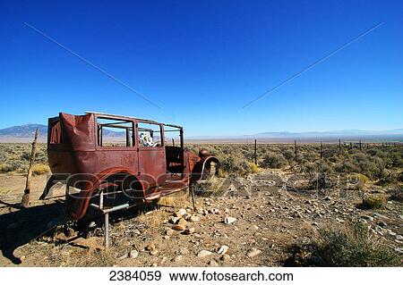 Car wreck on landscape, Nevada, USA View Large Photo Image Stock Photo - Car wreck on landscape, Nevada, USA . Fotosearch