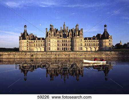 Stock Photograph - Castle along river, Chateau de Chambord, Chambord, Loire Valley, France, Europe . Fotosearch