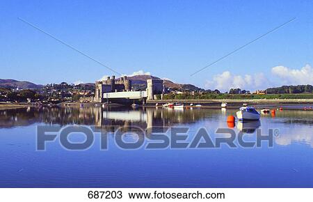 Stock Image - Castle at waterfront, Wales . Fotosearch
