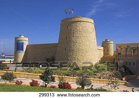 Castle in city against sky, Roquetas de Mar, Almeria, Spain View Large Photo Image Stock Image - Castle in city against sky, Roquetas de Mar, Almeria, Spain . Fotosearch