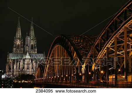 Cathedral and bridge lit up at night, Hohenzollern Bridge, Cologne Cathedral, Cologne, Rhineland, North Rhine-Westphalia, Germany View Large Photo Image Stock Photography - Cathedral and bridge lit up at night, Hohenzollern Bridge, Cologne Cathedral, Cologne, Rhineland, North Rhine-Westphalia, Germany . Fotosearch