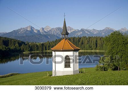 Chapel at the lake of Hegratsried near Halblech, Allgau, Germany View Large Photo Image Stock Photo - Chapel at the lake of Hegratsried near Halblech, Allgau, Germany . Fotosearch