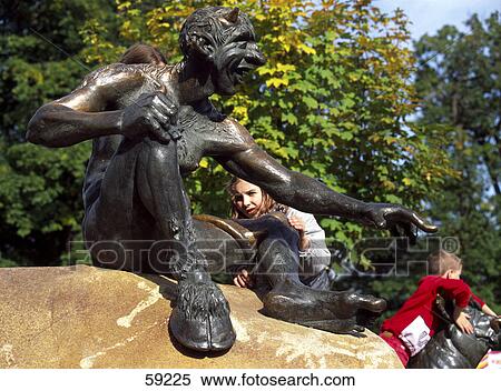 Stock Photography - Children climbing on sculptures in park, Brocken Mountain, Harz National Park, Saxony-Anhalt, Germany . Fotosearch