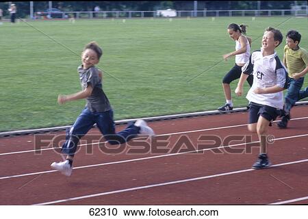 Stock Image - Children running at school race on track . Fotosearch