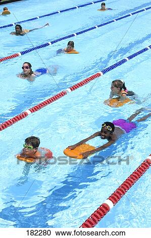 Children swimming in swimming pool View Large Photo Image Stock Image - Children swimming in swimming pool . Fotosearch