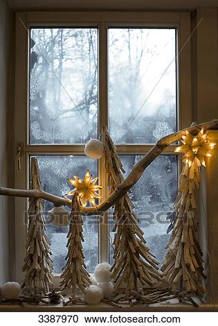 Stock Image - Christmas decoration at window pane . Fotosearch