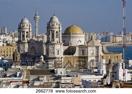 Church and houses in city, Costa de la Luz, Cadiz, Andalusia, Spain View Large Photo Image Stock Photo - Church and houses in city, Costa de la Luz, Cadiz, Andalusia, Spain . Fotosearch
