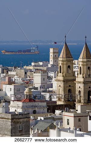 Stock Photo - Church and houses in city, St. Anthony Church, Costa de la Luz, Cadiz, Andalusia, Spain . Fotosearch