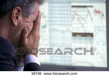 Close-up of businessman looking disappointed in front of computer monitor View Large Photo Image Stock Photography - Close-up of businessman looking disappointed in front of computer monitor . Fotosearch