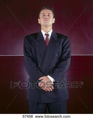 Close-up of businessman with his eyes closed View Large Photo Image Stock Photograph - Close-up of businessman with his eyes closed . Fotosearch