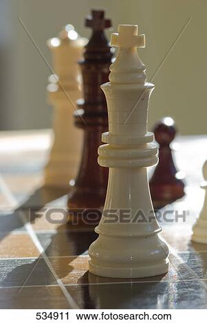 Close-up of chess pieces on chessboard View Large Photo Image Stock Image - Close-up of chess pieces on chessboard . Fotosearch