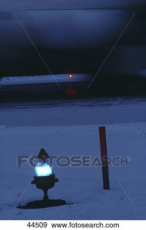 Stock Photo - Close-up of light on runway, Zurich, Switzerland, Europe . Fotosearch