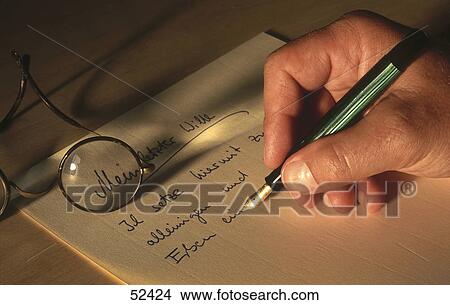Close-up of man writing with fountain pen View Large Photo Image Picture - Close-up of man writing with fountain pen . Fotosearch
