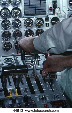 Close-up of pilot sitting in cockpit View Large Photo Image Stock Image - Close-up of pilot sitting in cockpit . Fotosearch
