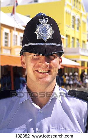 Stock Image - Close-up of policeman smiling, Bermuda . Fotosearch