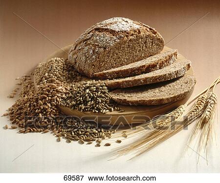 Stock Photo - Close-up of slices of bread on cutting board . Fotosearch