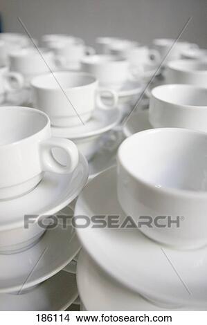 Picture - Close-up of stacks of coffee cups and saucers . Fotosearch