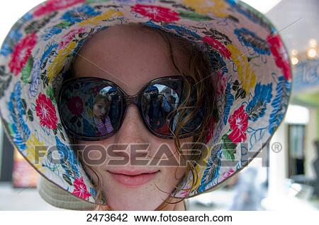 Close-up of teenage girl wearing sunglasses, Brighton, East Sussex, Sussex, England View Large Photo Image Stock Image - Close-up of teenage girl wearing sunglasses, Brighton, East Sussex, Sussex, England . Fotosearch
