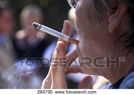 Close-up of woman smoking View Large Photo Image Stock Image - Close-up of woman smoking . Fotosearch
