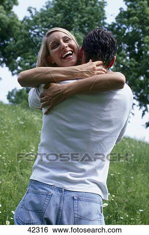 Stock Photograph - Couple embracing . Fotosearch