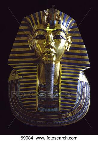 Picture - Death mask of Tutankhamun against black background, Egypt . Fotosearch