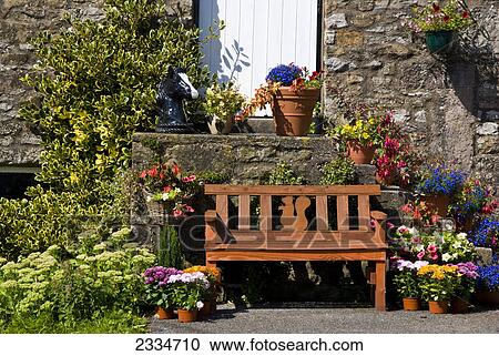 Empty bench surrounded with potted plants, Kirkby Lonsdale, Combria, England View Large Photo Image Stock Image - Empty bench surrounded with potted plants, Kirkby Lonsdale, Combria, England . Fotosearch