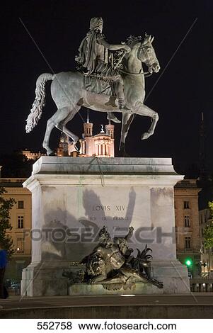 Stock Photo - Equestrian statue of Louis Xiv in front of church, Place Bellecour, Notre Dame De Fourviere, Lyon, Rhone-Alpes, France . Fotosearch