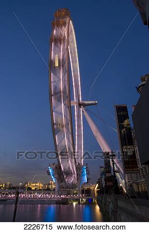Ferris wheel in motion, London Eye, Thames River, London, England View Large Photo Image Stock Photography - Ferris wheel in motion, London Eye, Thames River, London, England . Fotosearch
