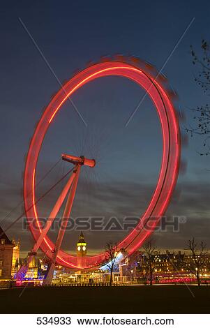 Ferris wheel lit up at night, Millennium Wheel, London, England View Large Photo Image Stock Image - Ferris wheel lit up at night, Millennium Wheel, London, England . Fotosearch