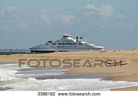 Stock Image - Ferry at the North Sea coast, List, Sylt, Germany . Fotosearch