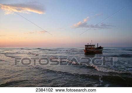Fishing boat in shallow water, Usedom, Ahlbeck, Mecklenburg-Western Pomerania, Germany View Large Photo Image Stock Image - Fishing boat in shallow water, Usedom, Ahlbeck, Mecklenburg-Western Pomerania, Germany . Fotosearch