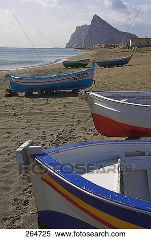 Fishing boat moored at beach, Rock Of Gibraltar, Gibraltar, Spain View Large Photo Image Stock Photography - Fishing boat moored at beach, Rock Of Gibraltar, Gibraltar, Spain . Fotosearch